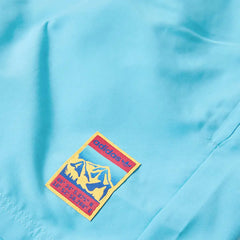 Close-up of adidas Adiplore 2.0 Woven Shorts GP1124 technical fabric and subtle Outdoor logo branding