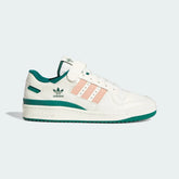 Adidas Forum 84 Low Men's trainers in off-white/cream leather, side profile showing iconic X-detail, hook-and-loop ankle strap, and classic silhouette.