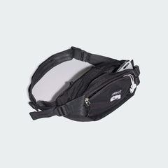 Inside view of the Adidas Adventure Waist Bag open, showing the main compartment and internal slip-in pocket.