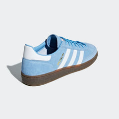 Angled side view of adidas Handball Spezial Men's shoes highlighting bold colour and classic shape