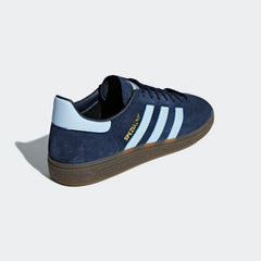 Angled side view of adidas Handball Spezial Men's shoes highlighting bold colour and classic shape