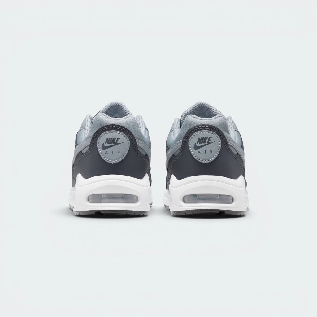 Focuses on the contoured rear paneling featuring the classic embroidered Nike Air branding and the clean finish of the sole casing.
