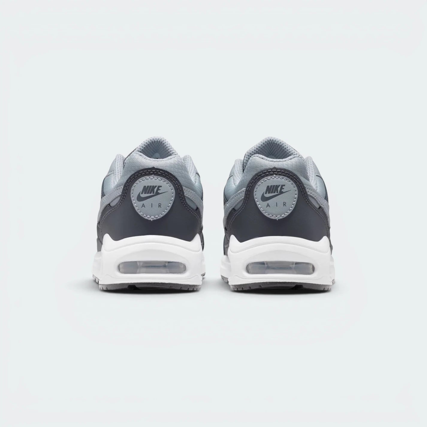 Focuses on the contoured rear paneling featuring the classic embroidered Nike Air branding and the clean finish of the sole casing.
