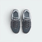 Focuses on the locked-in lace closure layout, the technical dark grey mesh on the toe box, and the classic branded tongue patches.