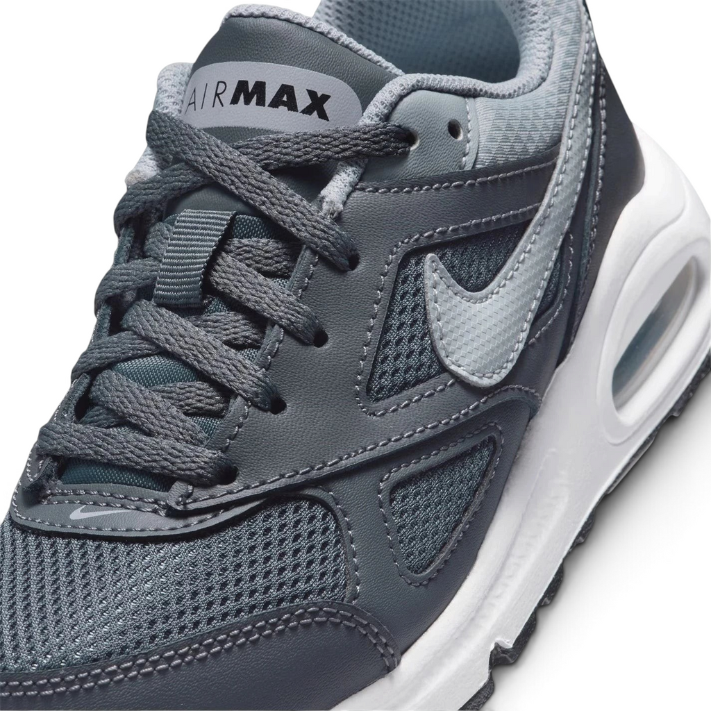 Details the high-definition textile weave on the toe box and the precision double-stitching around the front leather mudguards.