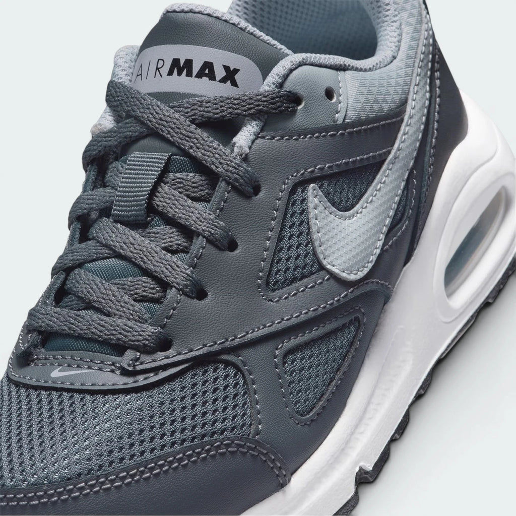 Details the high-definition textile weave on the toe box and the precision double-stitching around the front leather mudguards.