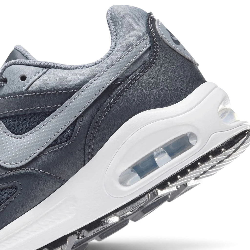 Highlights the "unreal" clean finish where the visible Max Air heel window cuts through the stable foam midsole wall.