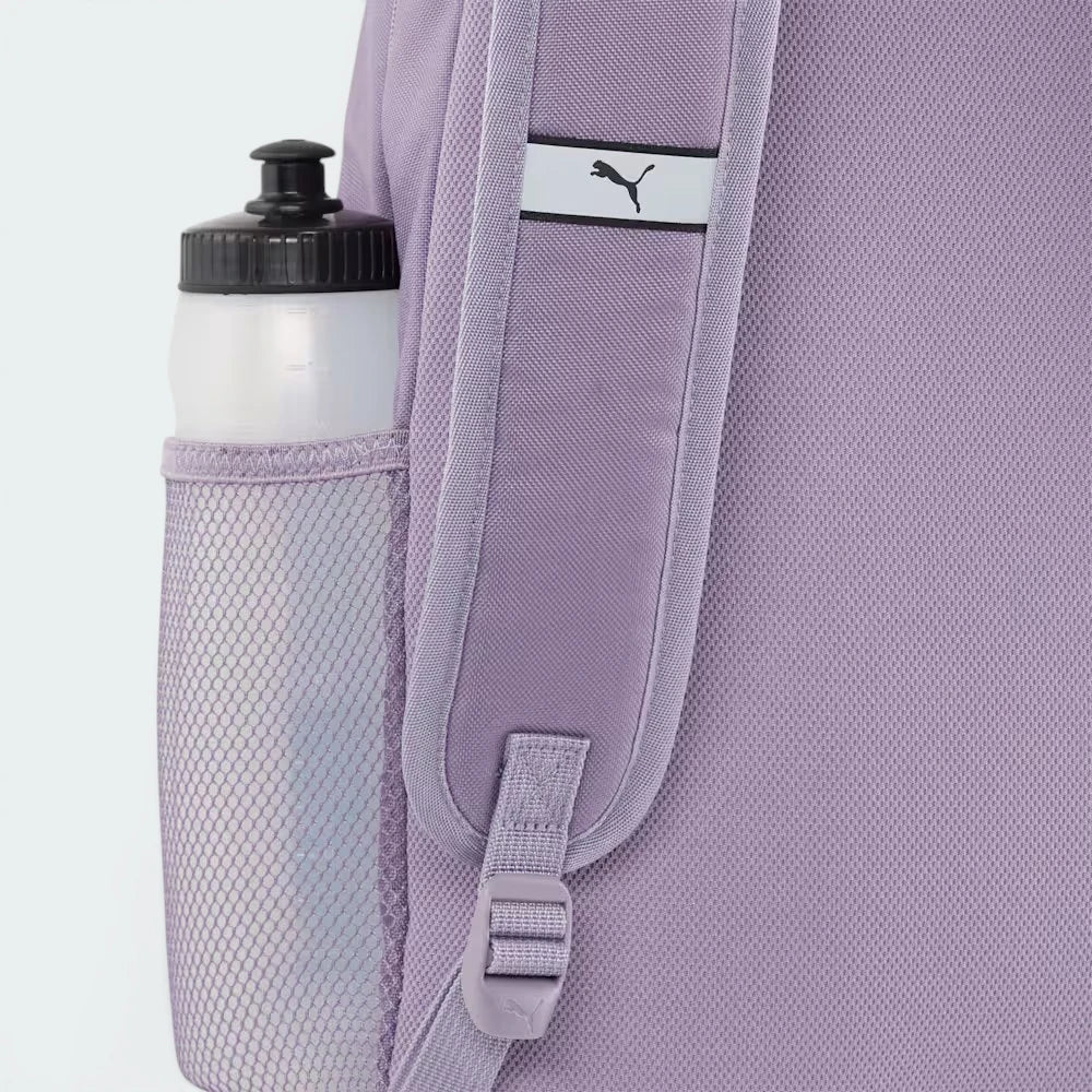 Highlights the high-velocity side mesh pocket and the professional depth of the backpack.