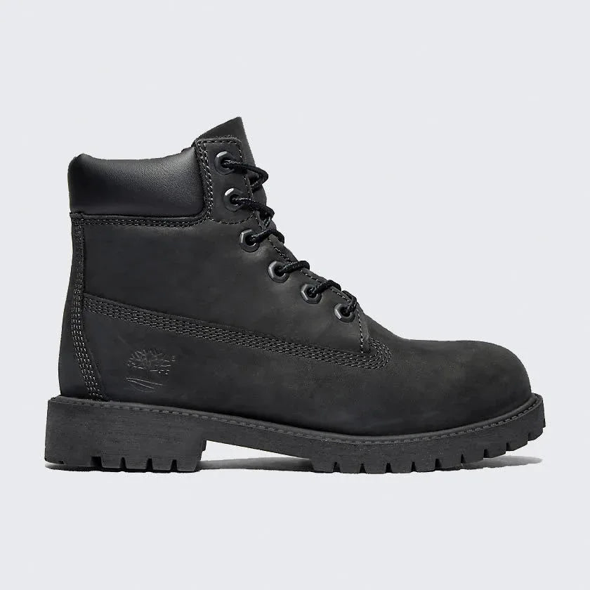 Timberland 6 Inch Premium Juniors' boots in black leather, side profile showing padded collar, lace-up design, and iconic tree logo. Main image