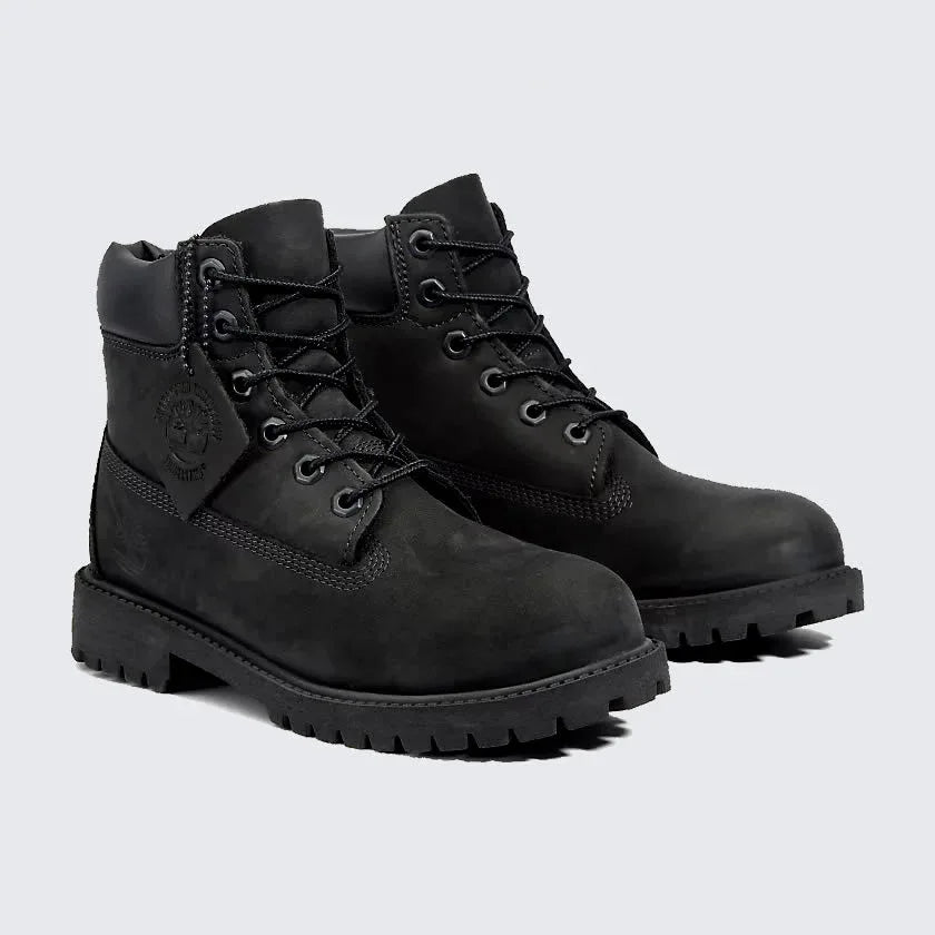 Angled view of two Timberland 6 Inch Premium Juniors' black boots, side by side, showcasing their classic waterproof design and sturdy build.