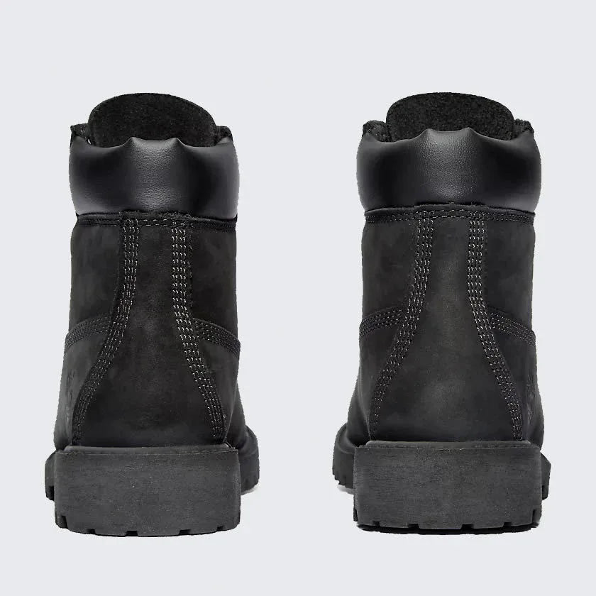 Rear view of the Timberland 6 Inch Premium Juniors' black boots, focusing on the structured heel and robust stitching.