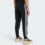 Focuses on the clean lines of the tapered legs and the professional finish of the tricot weave.