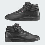 Reebok Freestyle Hi 2240 in black - styled on a foot, showing high-top fit
