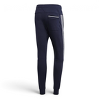 Navy blue jogger pants with white stripes on a light gray background