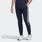Navy tracksuit with white stripes and Adidas logo on a white background