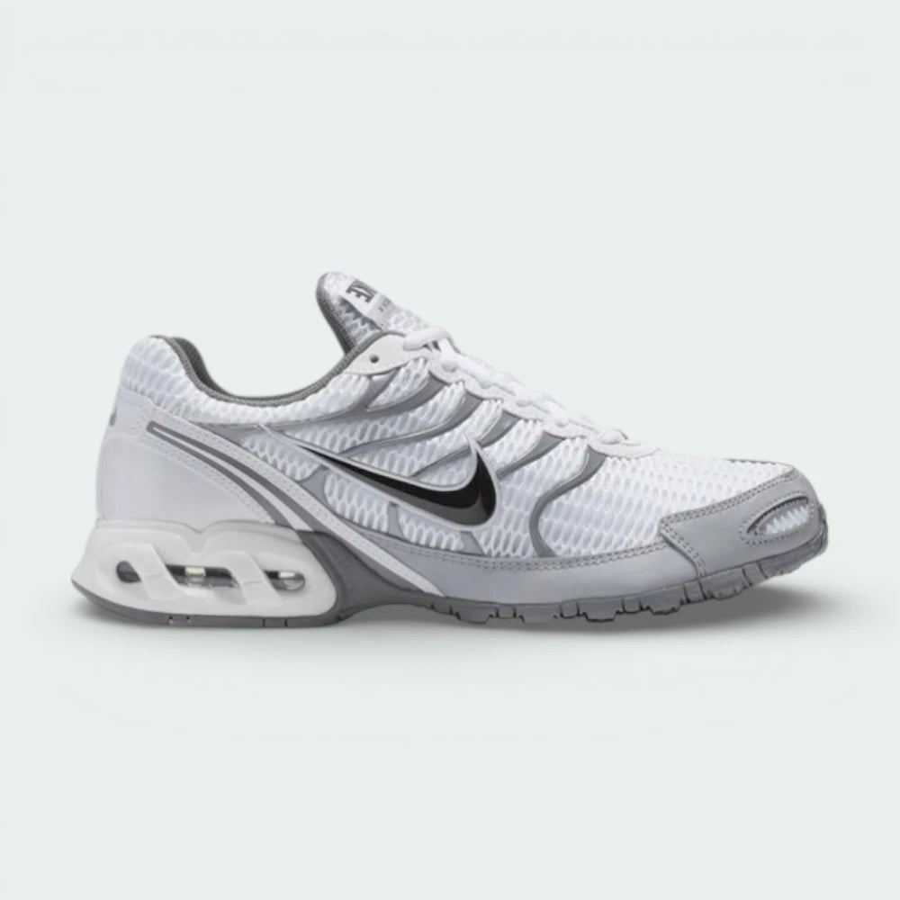 Highlights the visible Air-Sole unit and the sharp metallic silver overlays.