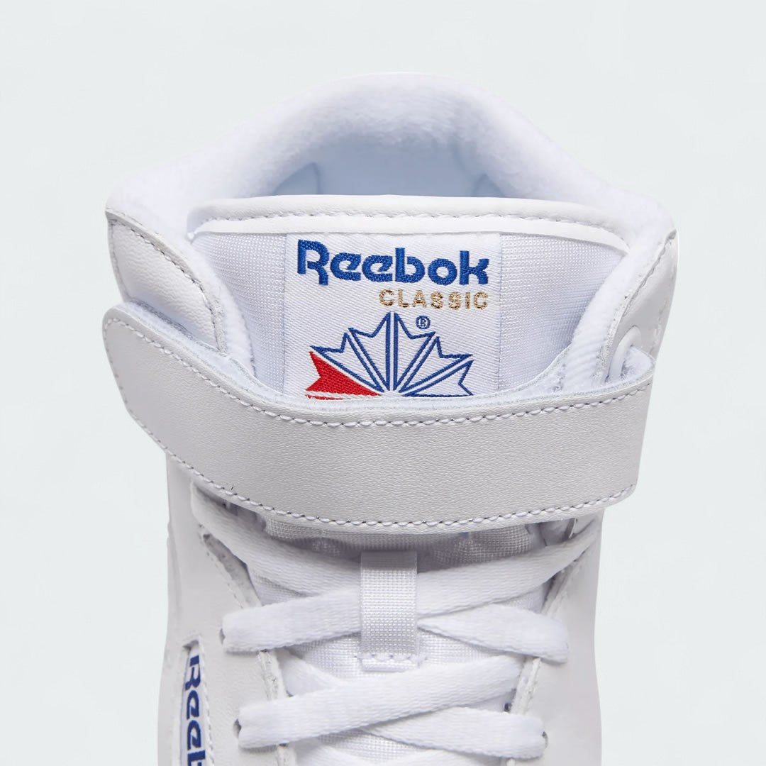 Close-up of Reebok EX-O-FIT Hi Men's White Leather Trainers 3477 leather texture, laces, and Velcro strap