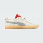 View of the outsole of the Puma Suede x Coca-Cola Unisex white trainers, inside of the shoes and pattern