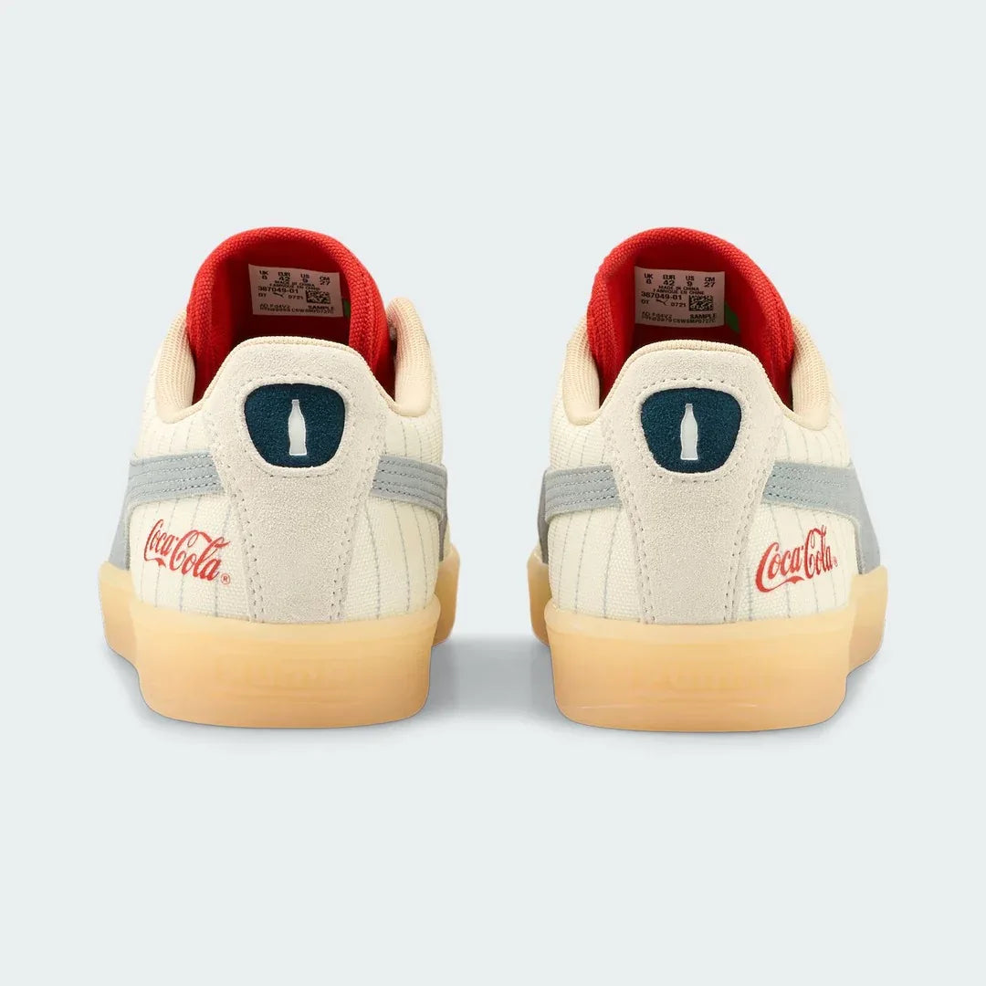 Rear view of the Puma Suede x Coca-Cola Unisex trainers, focusing on the Coca-Cola branding and red heel tab.
