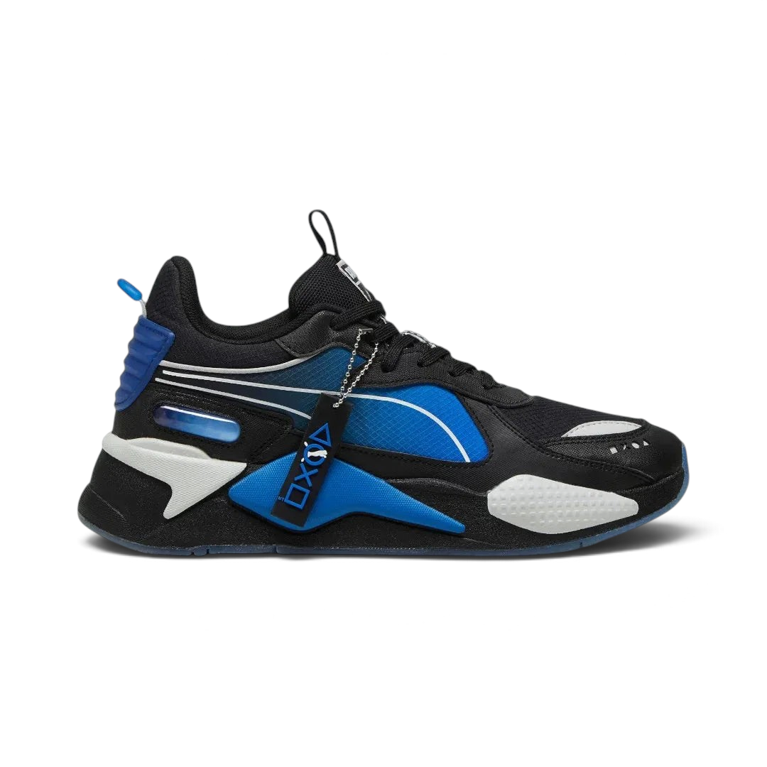 Puma RS-X x PlayStation Unisex trainers in black, side profile showing layered upper, thick sole with RS cushioning, and PlayStation logo. Main image