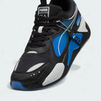 Close-up zoom on the front of the Puma RS-X x PlayStation Unisex trainers, showing the mesh and suede textures, lace-up system, and co-branded lace dubrae.