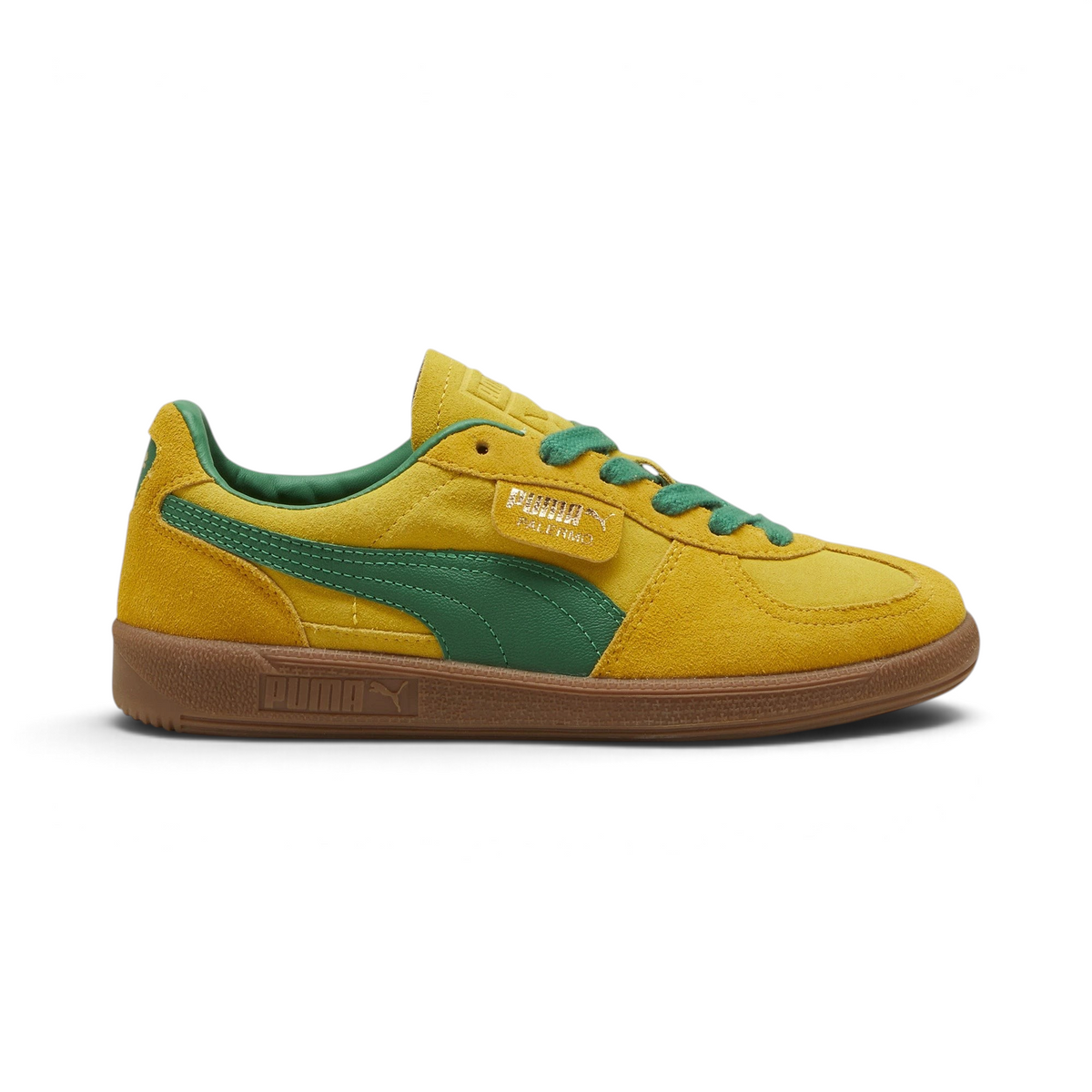 Highlights the high-velocity sweep of the green leather Formstrip, showing the professional, rich sheen of the Pelé Yellow suede upper and the shining gold foil Palermo branding flap.
