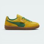 Highlights the high-velocity sweep of the green leather Formstrip, showing the professional, rich sheen of the Pelé Yellow suede upper and the shining gold foil Palermo branding flap.