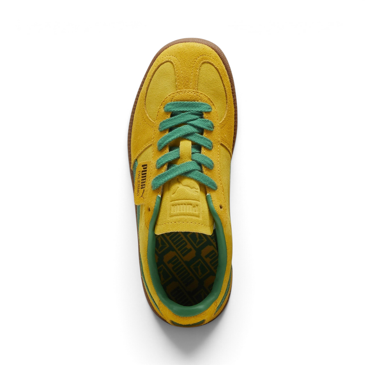Focuses on the locked-in traditional lacing layout, showing the clean alignment of the debossed suede tongue and the classic low-profile symmetry framing the toe box.