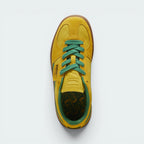 Focuses on the locked-in traditional lacing layout, showing the clean alignment of the debossed suede tongue and the classic low-profile symmetry framing the toe box.