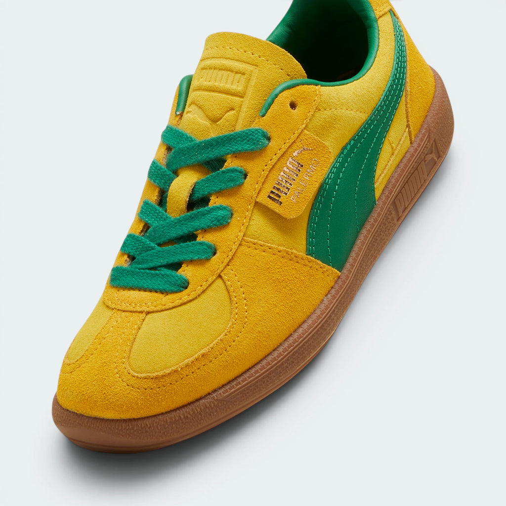 Details the premium dual-stitching lines crossing the velvety suede toe box cap and the precision lacing configuration eyelets.