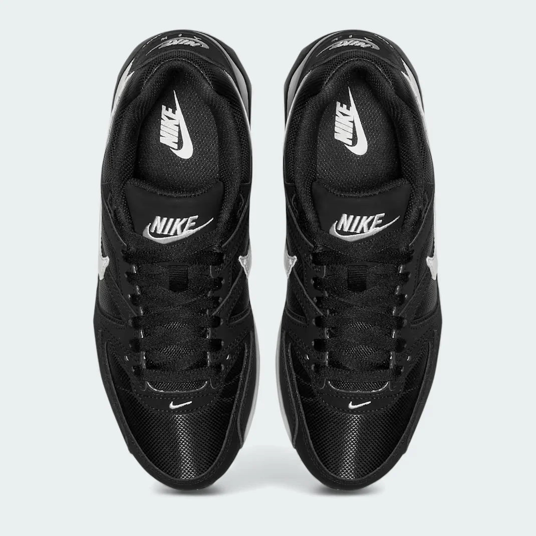 Top-Down view of a pair of Nike Air Max Command Women's trainers in black, highlighting their classic silhouette and lace-up closure.