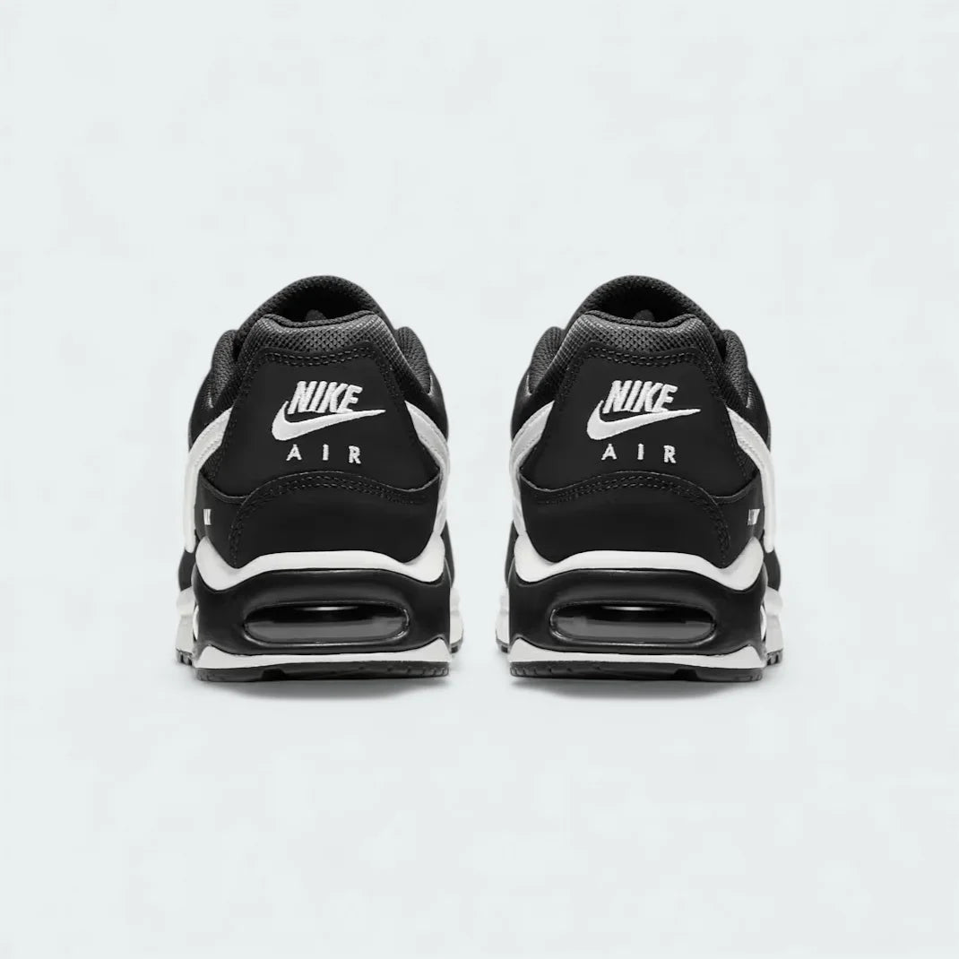 Rear view of the Nike Air Max Command Women's black trainers, focusing on the visible Max Air unit in the heel and padded collar.