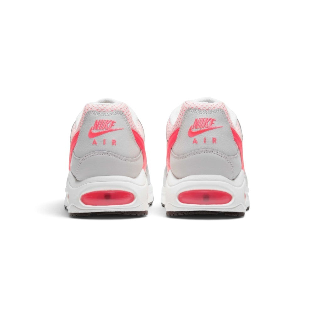 Focuses on the rear profile, highlighting the White leather heel counters stamped with Hyper Punch "NIKE AIR" logos and the wide stack of the foam midsole base.
