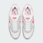 Focuses on the locked-in central lacing layout, displaying white mesh tongues, matching laces, Hyper Punch top eyelets, and insoles printed with Nike Air Max logos.