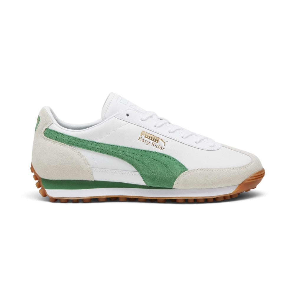 Displays the retro lateral silhouette featuring the crisp white leather chassis, light grey/off-white suede toe and heel overlays, rich green suede PUMA Formstrip, metallic gold foil "PUMA Easy Rider" script, dual-density white and green EVA wedge midsole, and studded gum rubber Federbein outsole. Main image