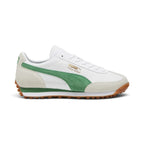 Displays the retro lateral silhouette featuring the crisp white leather chassis, light grey/off-white suede toe and heel overlays, rich green suede PUMA Formstrip, metallic gold foil "PUMA Easy Rider" script, dual-density white and green EVA wedge midsole, and studded gum rubber Federbein outsole.