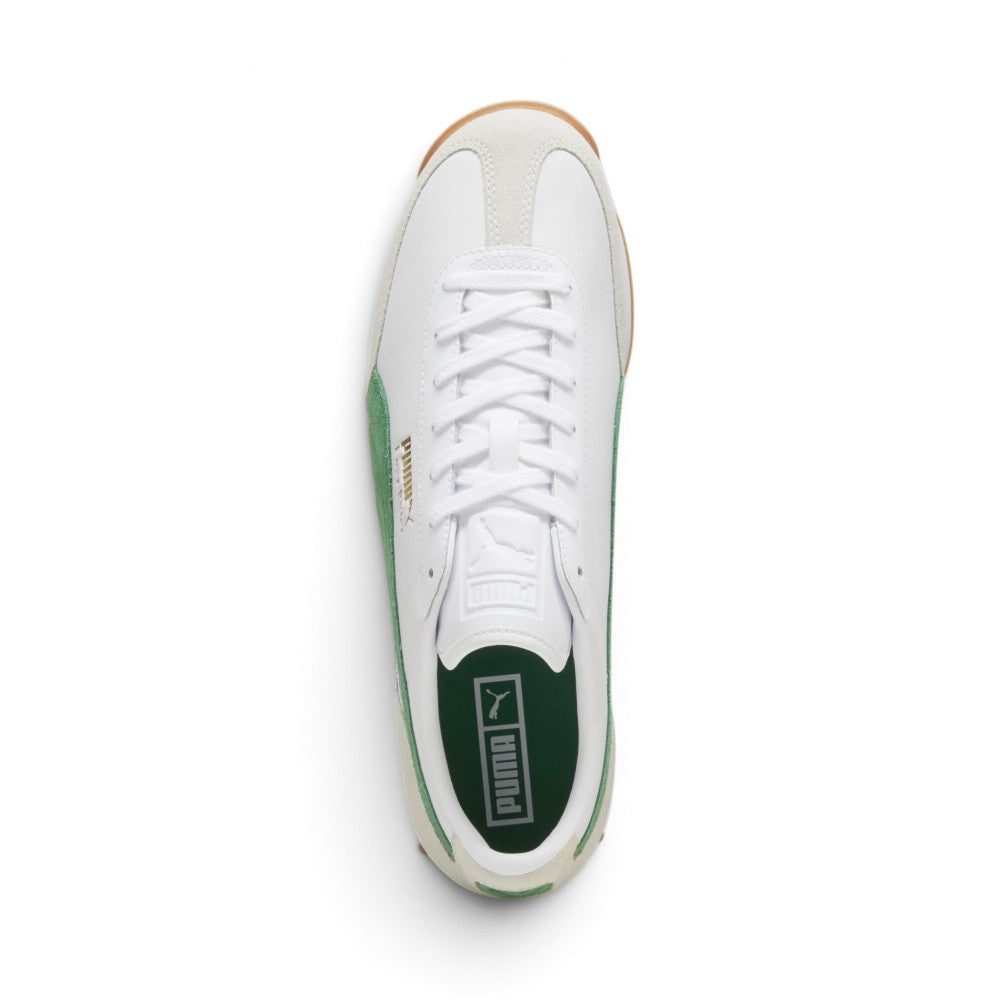 Overhead look showcasing the clean white leather upper, off-white suede T-toe mudguard overlay, central lacing system with flat white laces, embossed white leather tongue, green suede side Formstrip accents, and forest green padded sockliner with white PUMA branding.