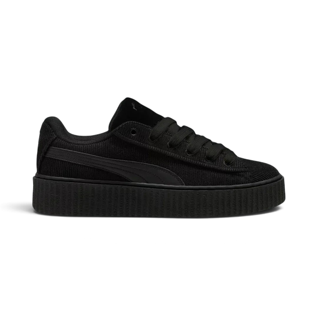 Puma Creeper Phatty x Fenty Unisex trainers in black corduroy, side profile showing the chunky platform sole and classic Puma Formstrip. Main image
