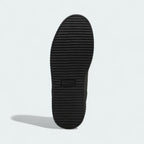 View of the outsole of the Puma Creeper Phatty x Fenty Unisex trainers, showing the thick rubber platform sole and tread pattern.