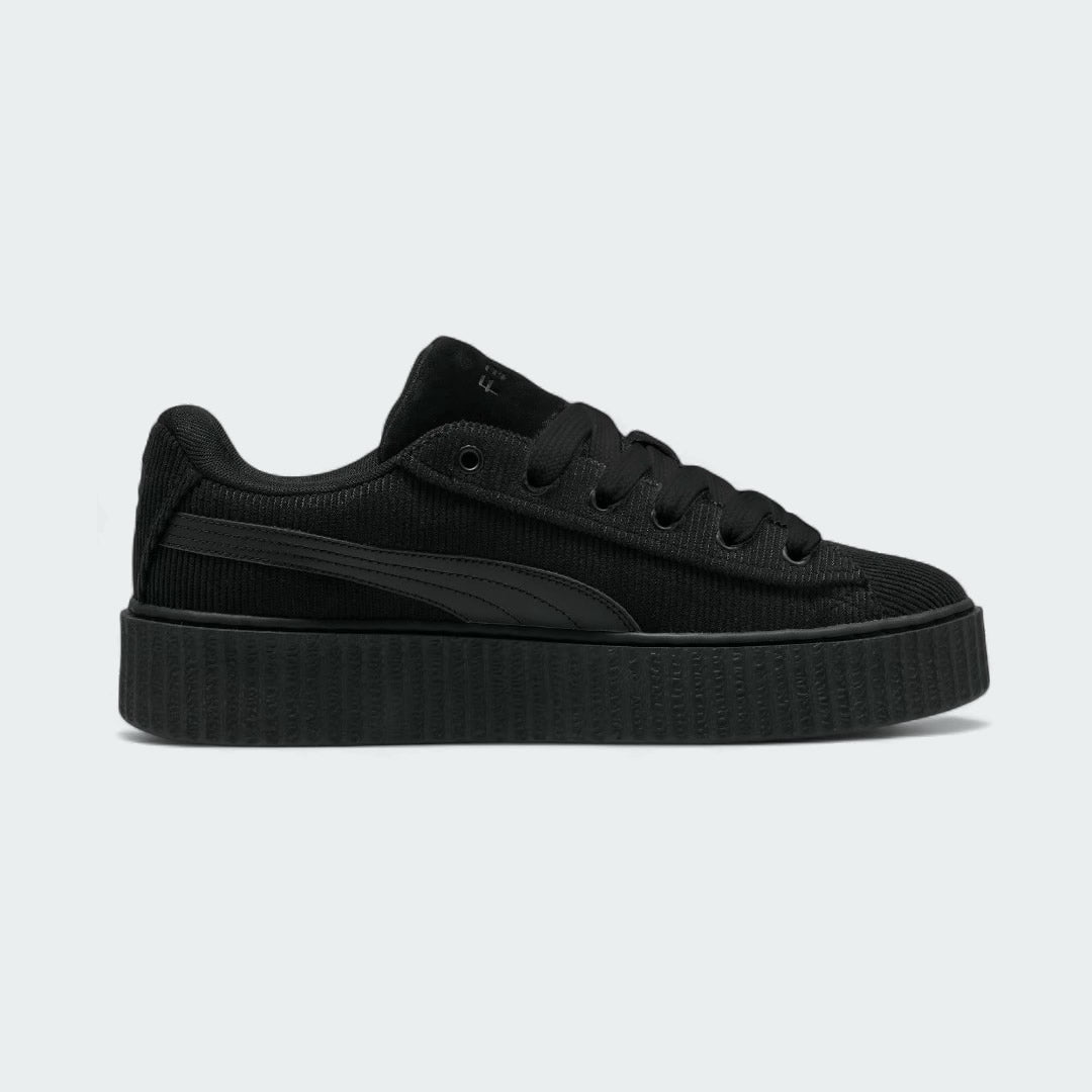 Puma Creeper Phatty x Fenty Women's trainers in black corduroy, inside profile showing the chunky platform sole and classic Puma Formstrip.