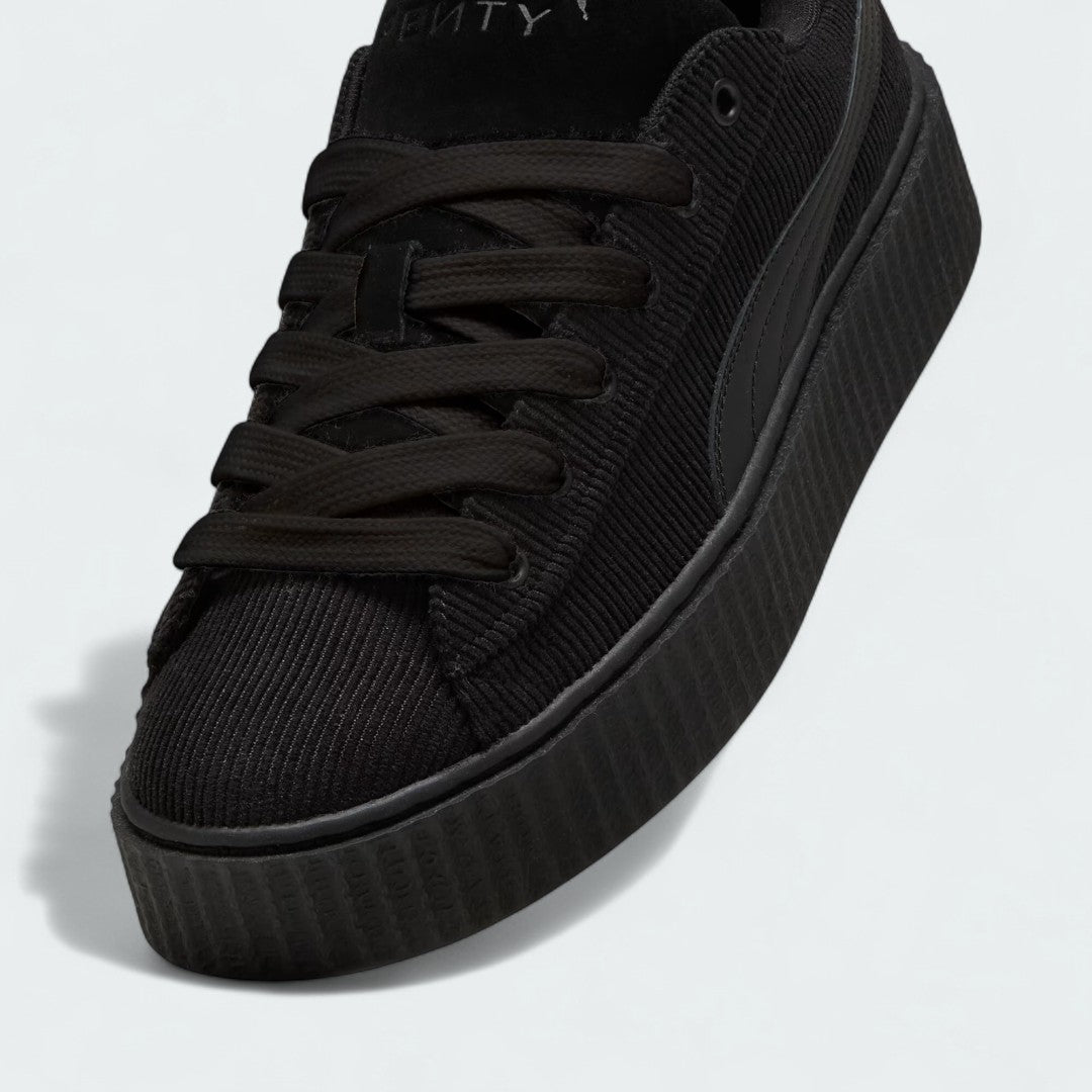 Close-up zoom on the front of the Puma Creeper Phatty x Fenty Women's trainers, showing the corduroy texture, lace-up system, and co-branded tongue.