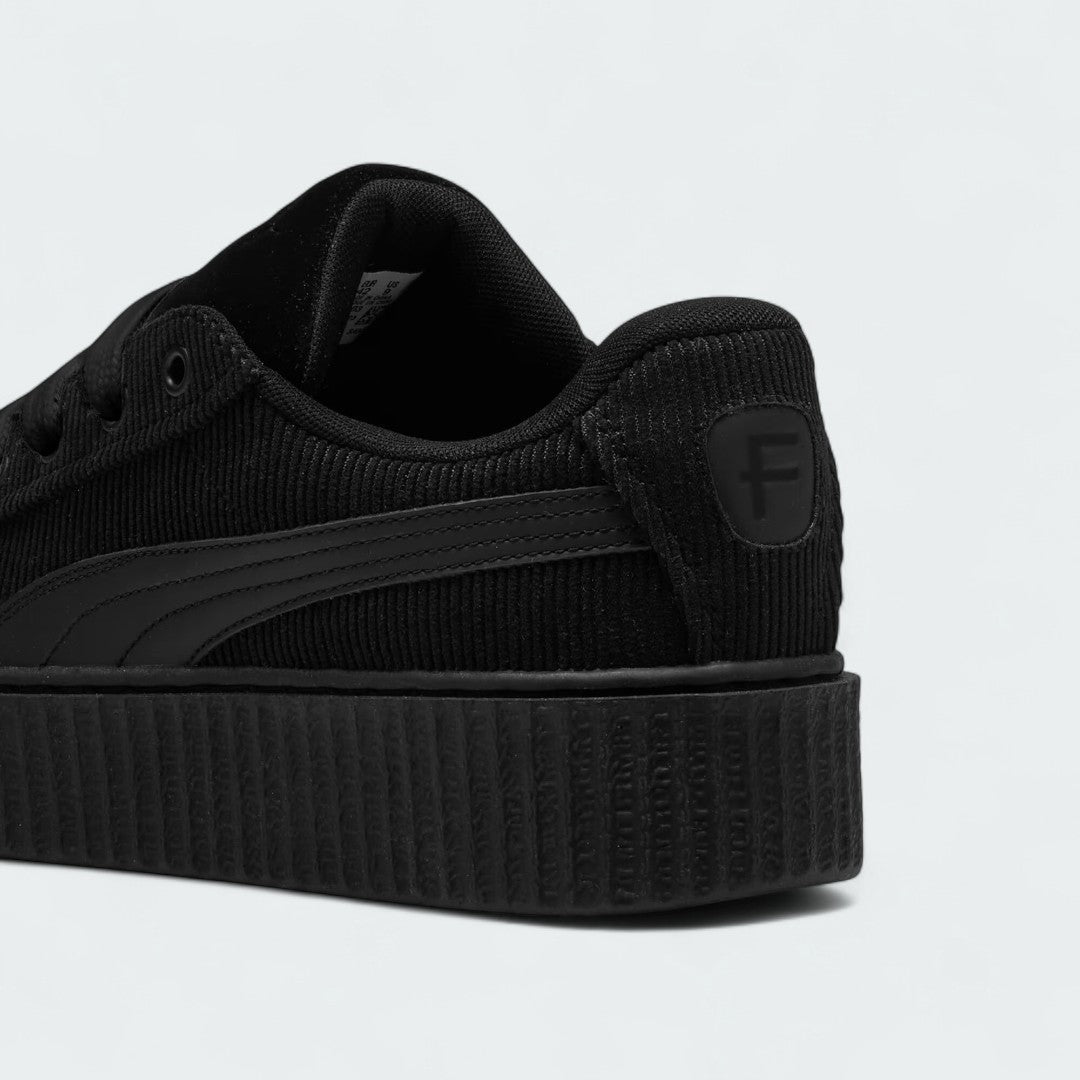 Rear view of the Puma Creeper Phatty x Fenty Women's trainers, focusing on the thick sole and Puma branding.