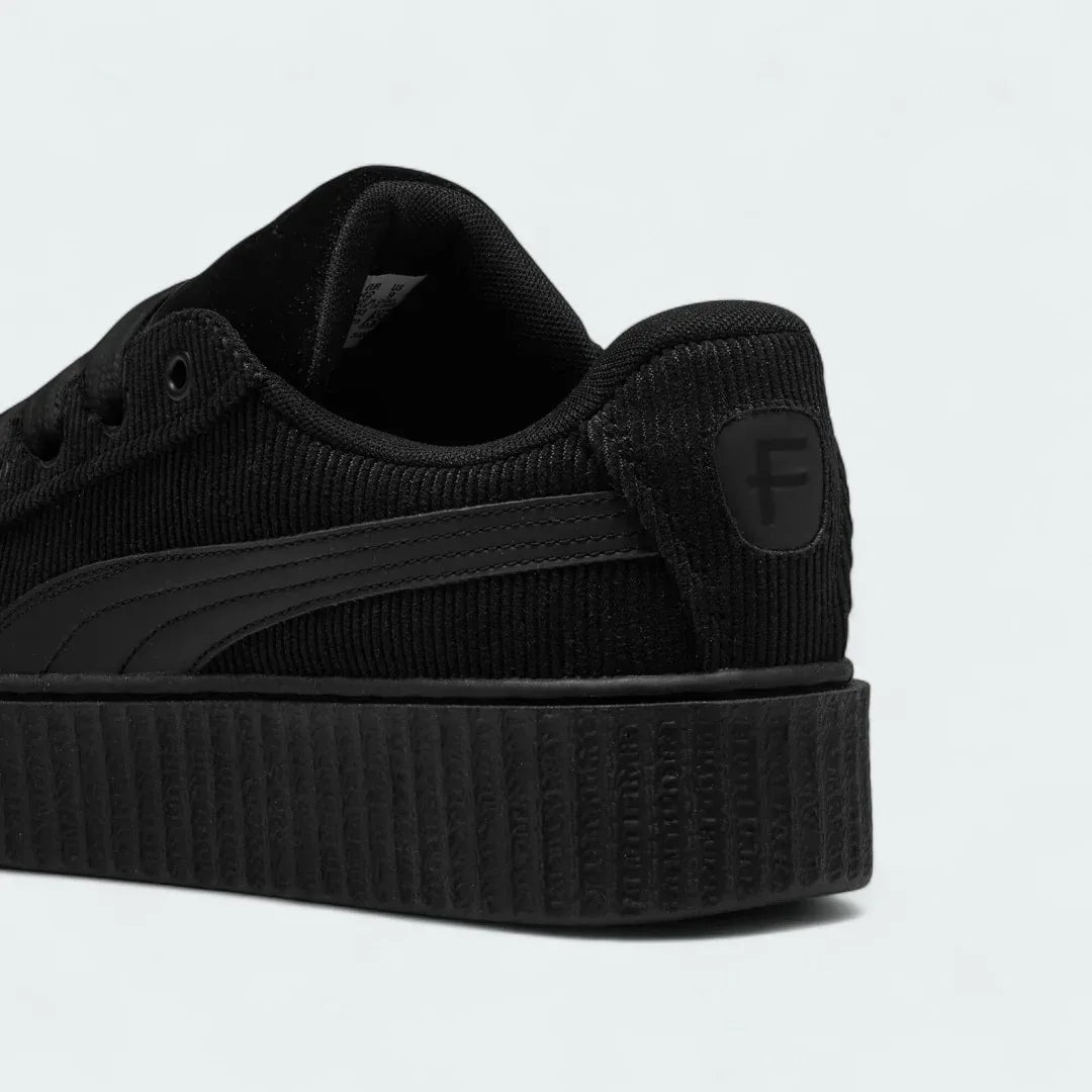 Rear view of the Puma Creeper Phatty x Fenty Unisex trainers, focusing on the thick sole and Puma branding.