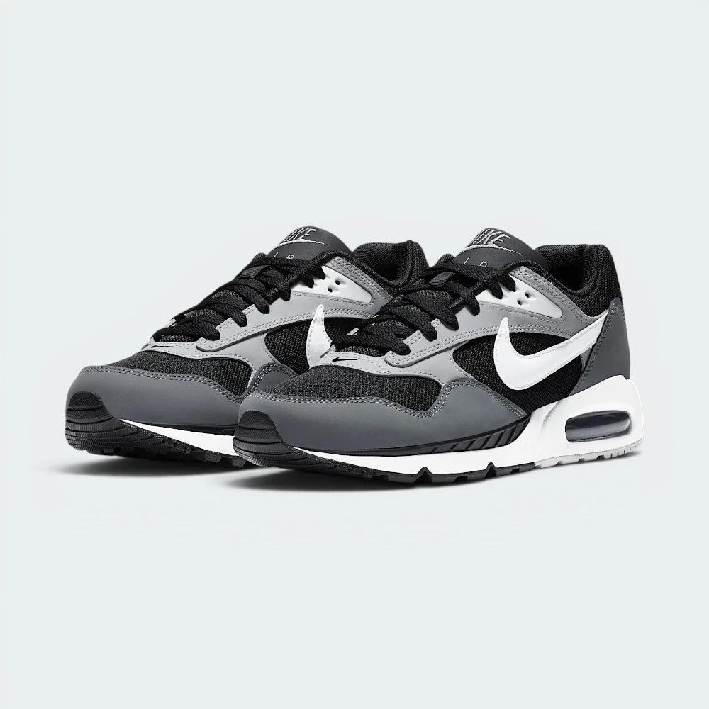 Emphasising the clean lines of the low-top aerodynamic silhouette and the professional alignment of the grey gradient panels.