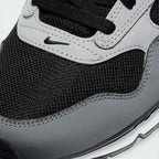 Details the high-definition textile weave on the toe box and the precision double-stitching around the front suede guards.