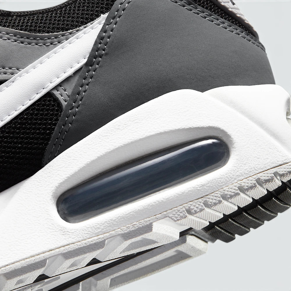 Highlights the "unreal" clean finish where the visible Max Air heel window cuts through the stable foam midsole wall.
