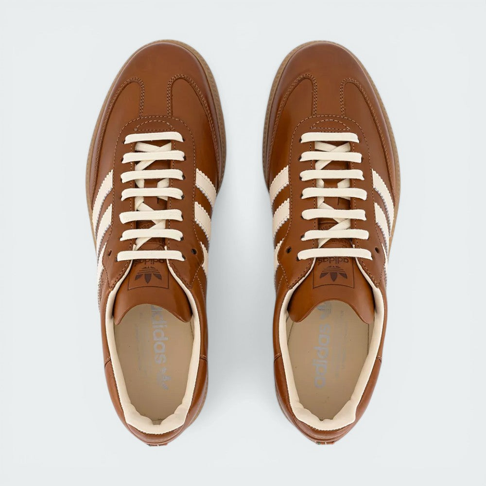 Looking down at the premium tan lacing system and the refined mesh panels on the midfoot.
