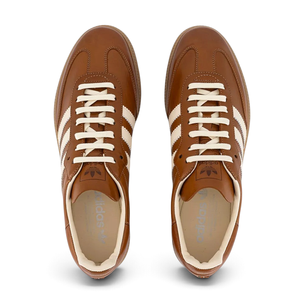 Looking down at the premium tan lacing system and the refined mesh panels on the midfoot.