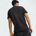 Puma Ferrari Style Jacquard Polo Men's in black, rear model image showing short sleeves, classic fit, and subtle jacquard texture.