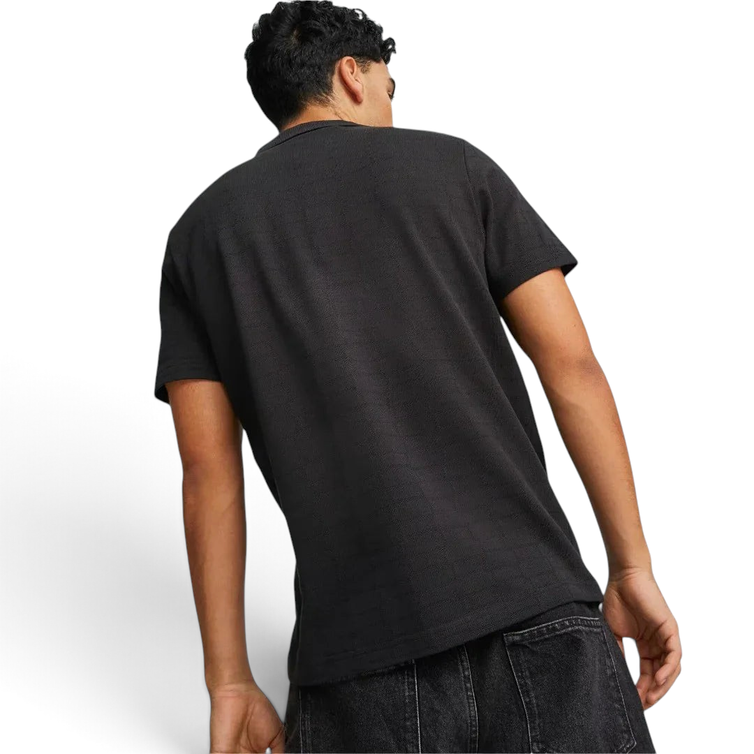 Puma Ferrari Style Jacquard Polo Men's in black, rear model image showing short sleeves, classic fit, and subtle jacquard texture.